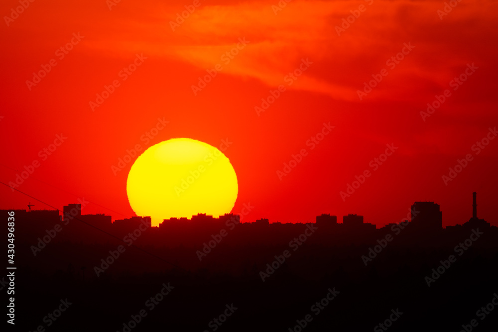 Scenic sunset over city silhouette