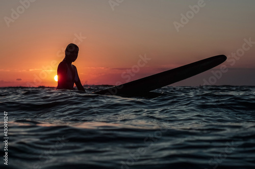 Wallpaper Mural Portrait from the water of surfer girl with beautiful body on surfboard in the ocean at sunset time in Bali Torontodigital.ca