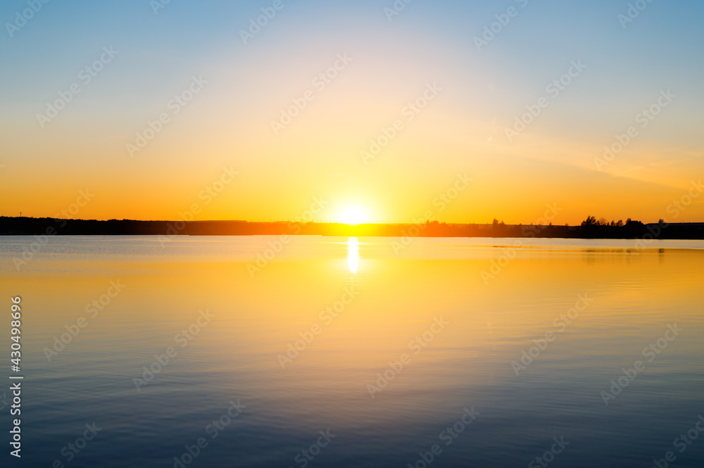 Summer sunset over the lake. Minimalistic landscape