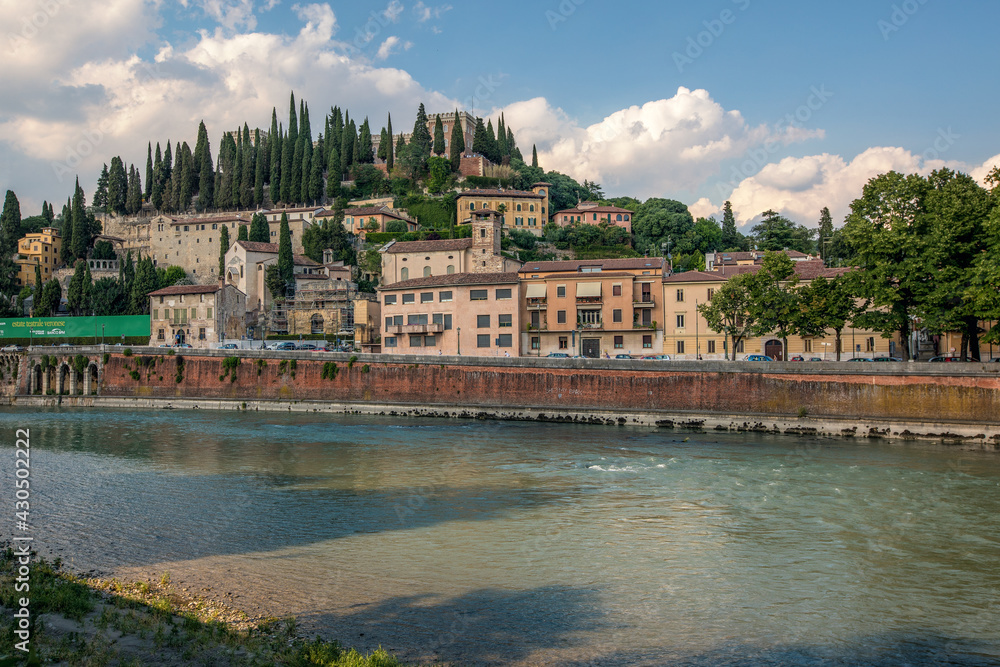 Verona, Italy, 07.04.2019: view to Castle San Pietro from the bank of the river Adige