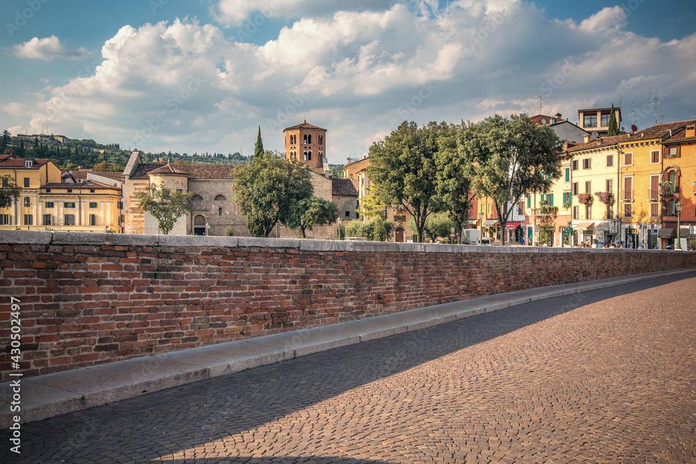 Verona, Italy, 07.04.2019: view from Ponte Pietra bridge to Castle San Pietro in the sunny afternoon
