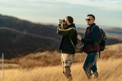 Two friends hiking in the hills