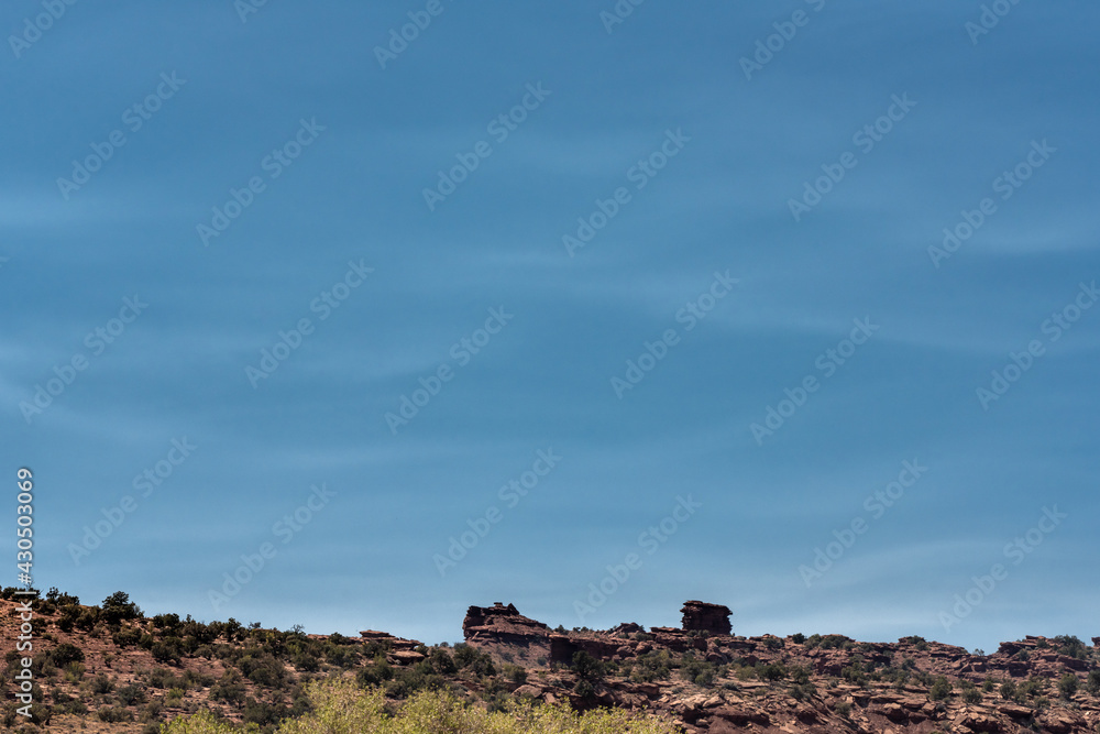 Whispy Clouds In Blue Sky Over Desert Ridge