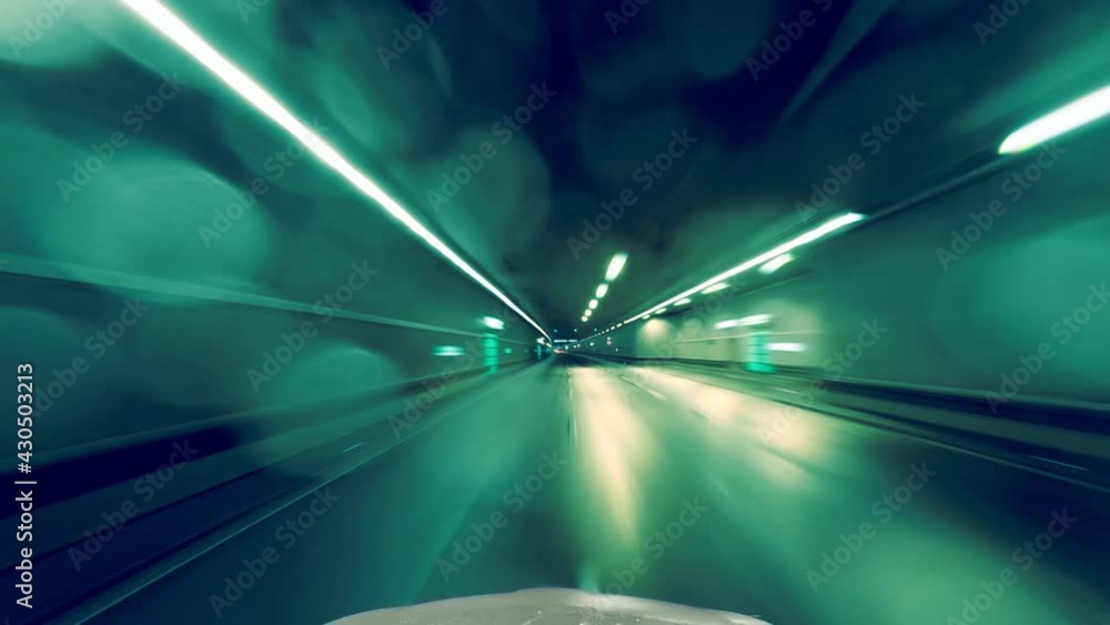 Fast car drive through a underground tunnel in the teal and orange look through the drivers view at night - concept clip for high speed ideas.