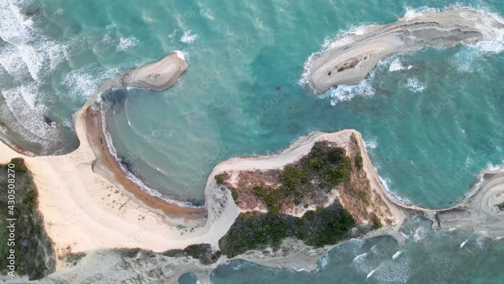Top down aerial view of Cape Drastis with waves, Corfu, Greece Top down aerial view of Cape Drastis with waves, Corfu, Greece