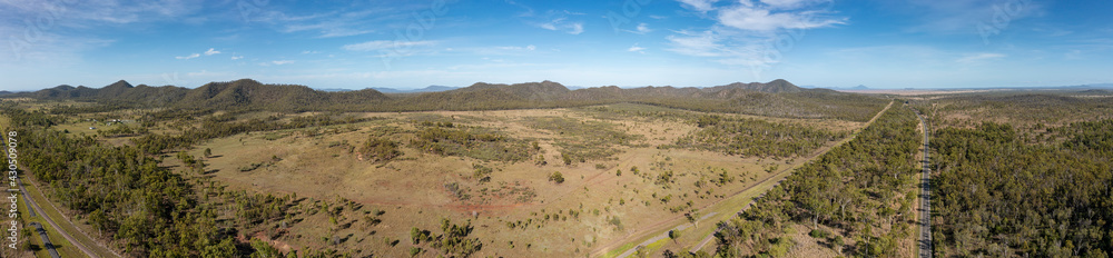 Aerial panoramic view of the Bruce Highway at Kunwarara in Queensland Australia; the view encompasses the Lake Learmouth State Forest.