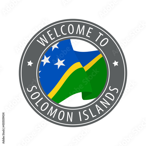 Welcome to Solomon Islands. Gray stamp with a waving country flag.