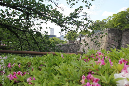 Osaka Castle moat is surrounded by large stone walls