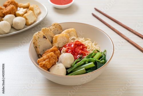 egg noodles with fish balls and shrimp balls in pink sauce, Yen Ta Four or Yen Ta Fo