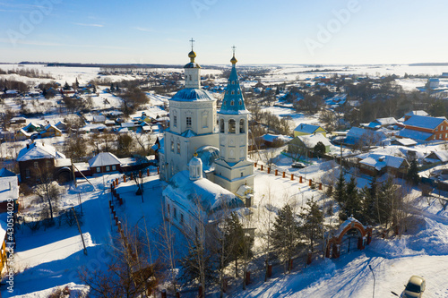 Aerial view of snow covered Venyov townscape with architectural ensemble of Orthodox church of Our Lady of Kazan and Epiphany church in winter, Tula Oblast, Russia photo