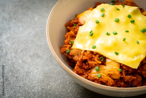 kimchi fried rice with pork and topped cheese photo