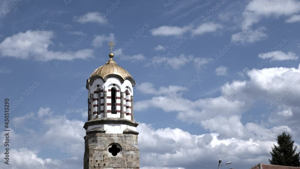Eastern Orthodox church bell tower Bulgaria.Timelapse clouds slow zoom Eastern Orthodox church bell tower Bulgaria.Timelapse clouds slow zoom