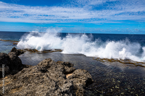 The blow holes which are certainly displaying their power in this picture are popular tourist attraction on the main island of Tonga.