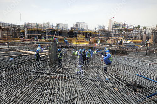 Workers working in Steel structural construction in Oman Building in Oman. Oman city