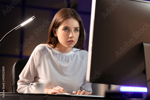 Young woman using computer ...