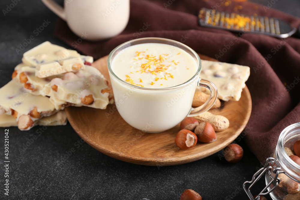 Cup with hot white chocolate on dark background Cup with hot white chocolate on dark background