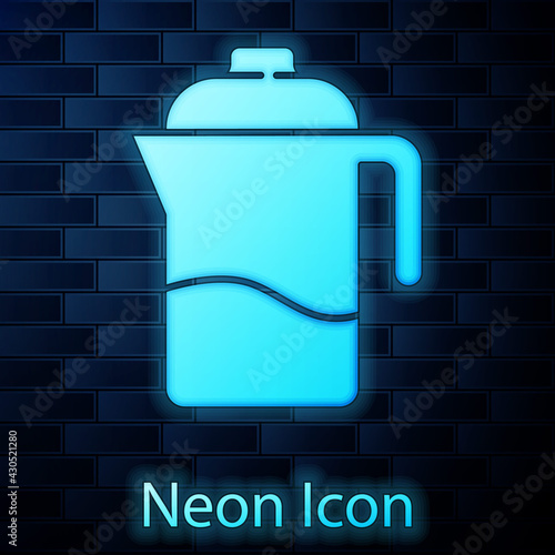Glowing neon French press icon isolated on brick wall background. Vector