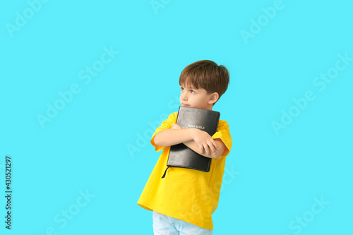 Little boy with Bible on co...