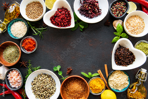 Various spices in a bowls on a black