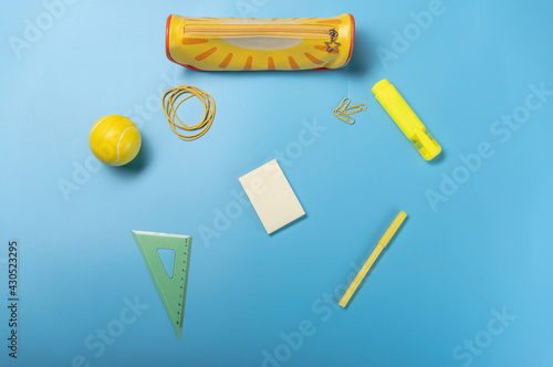 Diverse school office. Yellow office on a blue table. photo