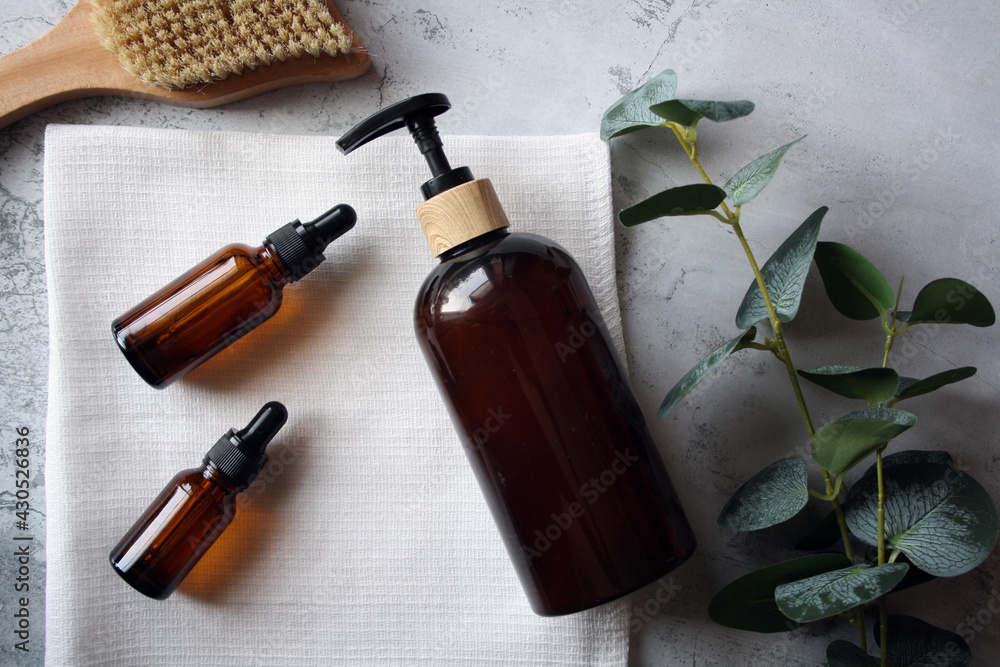 Set of brown glass cosmetic bottles. Skin care, organic body treatment, spa concept. Set of brown glass cosmetic bottles. Skin care, organic body treatment, spa concept.