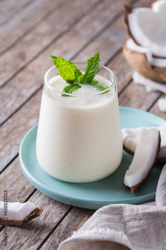Healthy vegan coconut indian lassi on a table Healthy vegan coconut indian lassi on a table