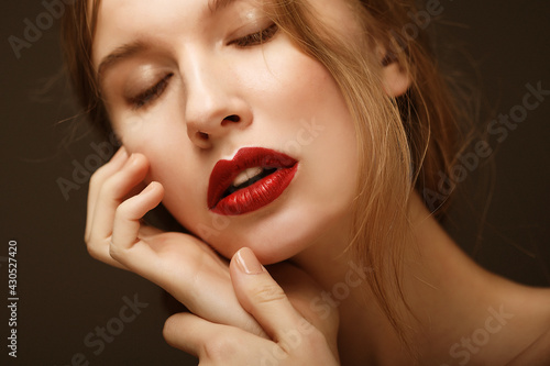 Beauty face of young woman  red lips make-up  clean skin.