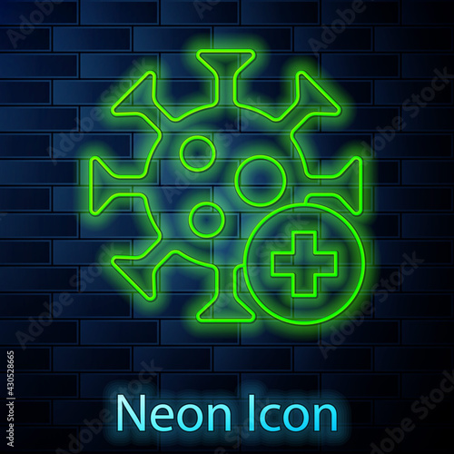Glowing neon line Positive virus icon isolated on brick wall background. Corona virus 2019-nCoV. Bacteria and germs, cell cancer, microbe, fungi. Vector.