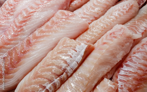 Obraz na płótnie Seabass, hamour, grouper fish, sea bass fillet many pieces sliced piled bulk in fish market