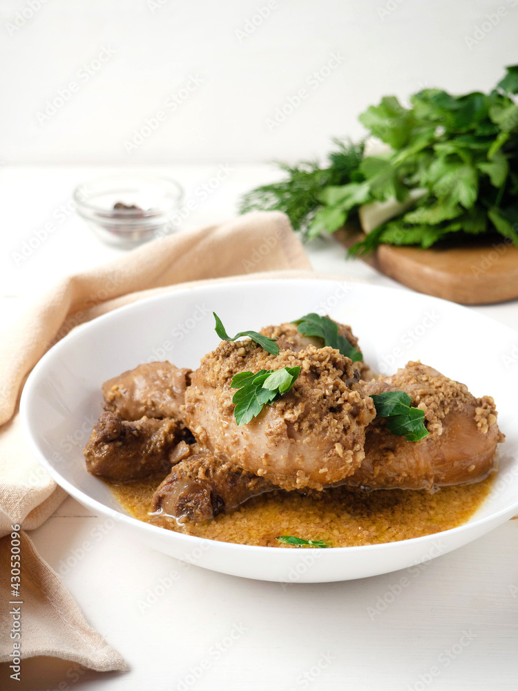 Chicken with walnut sauce. Georgian dish, satsivi Chicken with walnut sauce. Georgian dish, satsivi