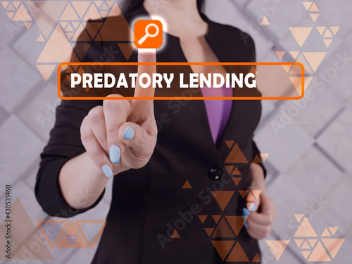  PREDATORY LENDING phrase on the screen. Marketing expert use cell technologies at office.