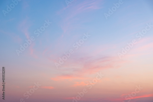 Colorful sunset and sunrise with clouds. Blue and orange color of nature. Many white clouds in the blue sky. The weather is clear today. sunset in the clouds. The sky is twilight. © gexphos