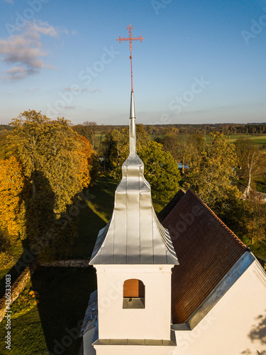 Aerial view of Lenas catholic church in sunny autumn evening, Latvia. photo