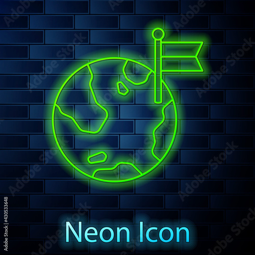 Glowing neon line Planet with flag icon isolated on brick wall background. Victory, winning and conquer adversity concept. Vector
