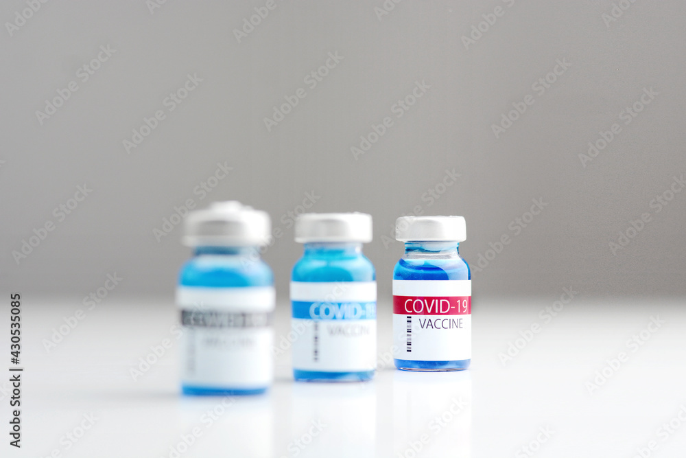 Three Coronavirus vaccine bottle.Vaccination covid-19, medical research and development concept. Three Coronavirus vaccine bottle.Vaccination covid-19, medical research and development concept.