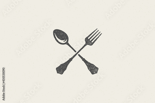 Crossed spoon and fork silhouette for food service hand drawn stamp effect vector illustration.