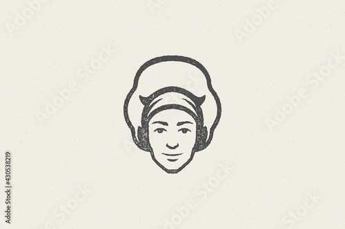 Logo icon head of smiling male cook silhouette in chef hat hand drawn stamp effect vector illustration.