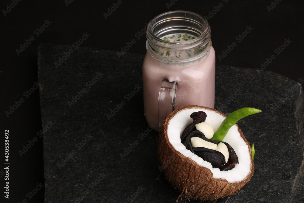 Solkadhi OR Kokum curry, A famous drink from Goa or Maharashtra`s Konkan region, served in a glass. - obrazy, fototapety, plakaty 