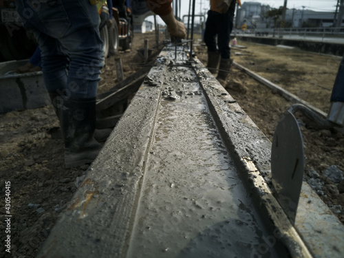 workman is lay cement in ground beam, Shallow foundations are typically used where the loads imposed by a structure are low relative to the bearing capacity of the surface soils