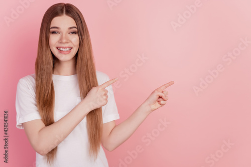 Photo of woman forefinger indicate empty space