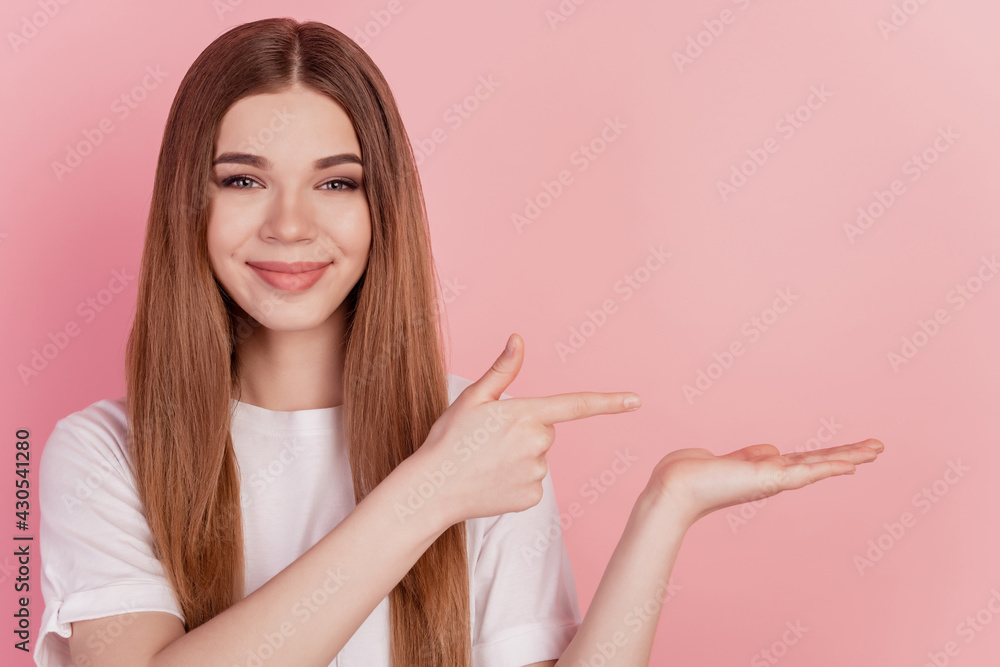 Young woman showing finger direct empty space hand hold advertise object Young woman showing finger direct empty space hand hold advertise object