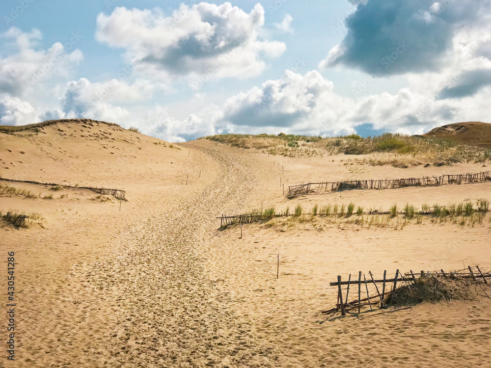 Grey dunes in summer time and sky background. Beautiful natural beauty of Curonian Spit, Lithuania.