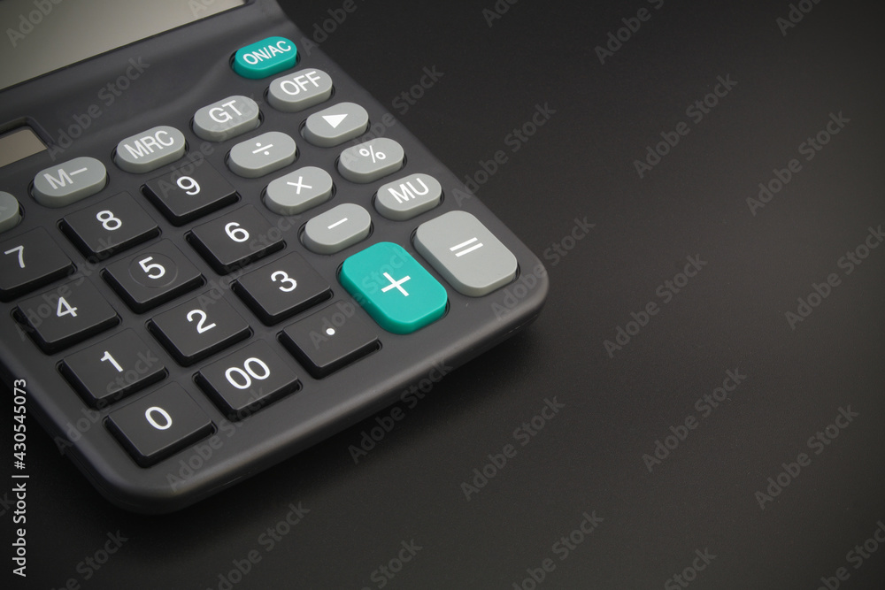 Black calculator on black table with space for text. Black calculator on black table with space for text.