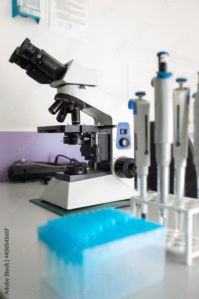 Microscope on the table in the laboratory, the technology of scientific research Microscope on the table in the laboratory, the technology of scientific research