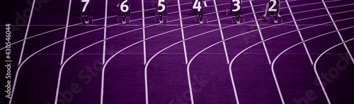 Starting blocks in track and field. Professional sport concept. Purple color filter