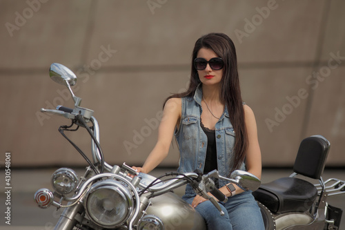 Portrait of young woman on a motorcycle © zhagunov_a