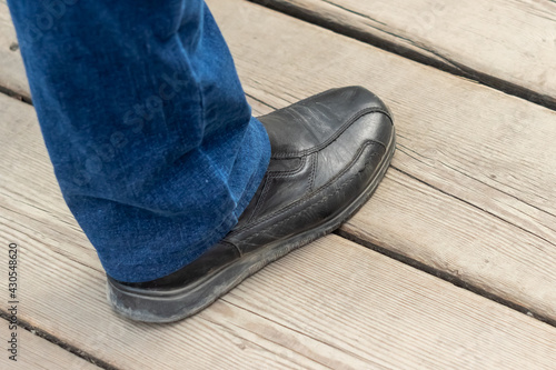 male foot in a black shoe close-up