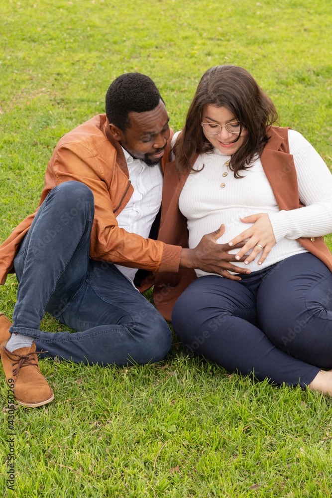 Couple expecting a baby touch the belly smiling Couple expecting a baby touch the belly smiling