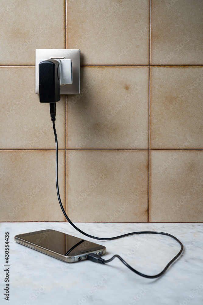 A cell phone charging A cell phone charging