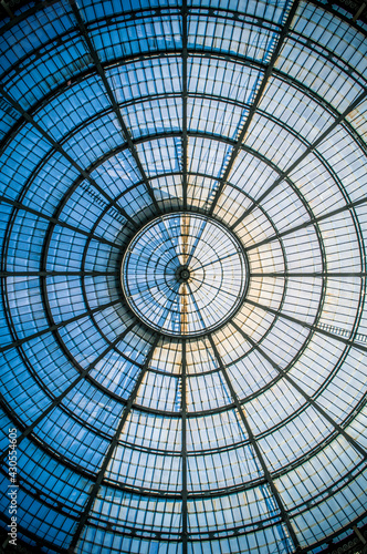 Abstract circular pattern of the glass dome of the Galleria Vittorio Emanuele II in Milan, Lombardy, Italy.